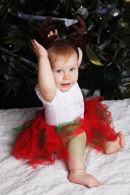 Baby with christmas background. Happy New Year!