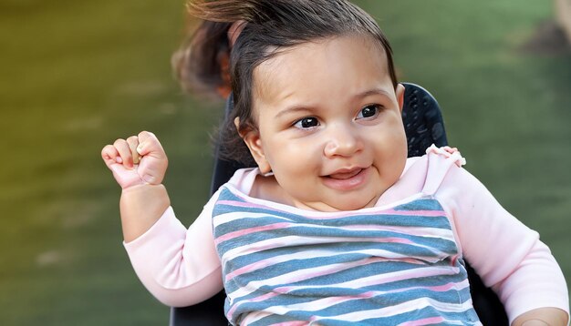 Photo baby with curly hair and happy eyes