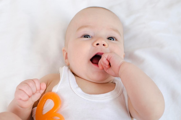 A baby with a letter b on his chest