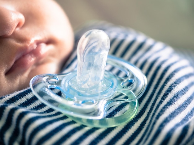 Photo baby with pacifier sleeping