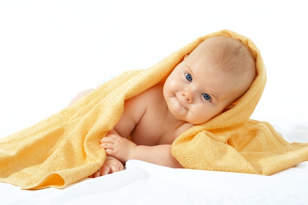 Baby in yellow towel