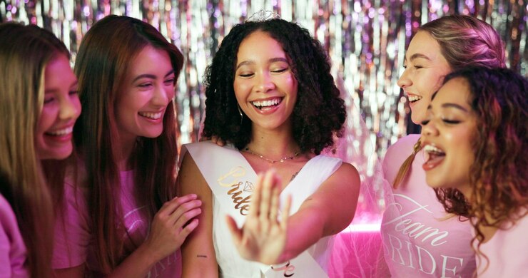 Photo bachelorette party wedding ring and friends with people at club for bride to be announcement and night out support bridal shower and celebration with women for social event happy and group