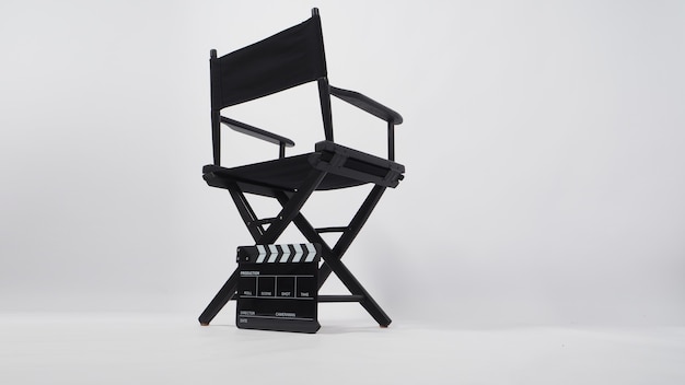 Photo back of black director chair and clapper board on white background