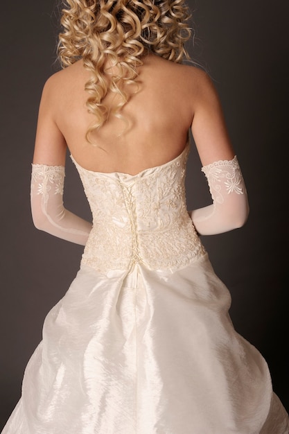 Back of bride in wedding dress.