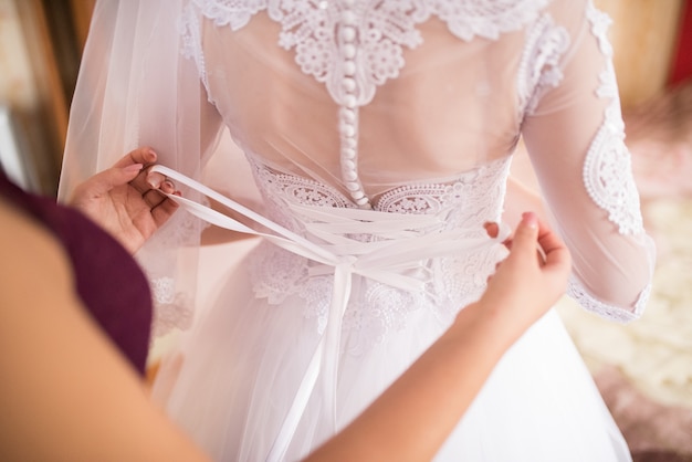 The back of the bride in a wedding dress