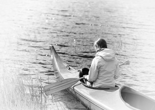 Back of the girl in boat with oar sepia backgorund hd