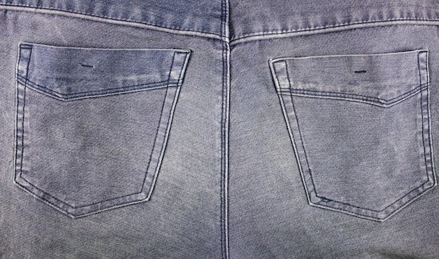 Back jeans pockets Jeans dark blue high definition texturePockets on trousers dark jeans closeup highdefinition texture