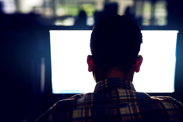 back man and computer screen in office at night as developer for software development coding and working late programmer mockup pc and process script firewall update and it for data protection