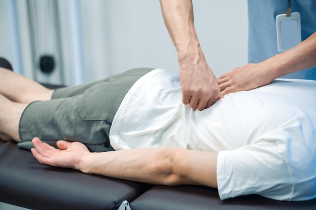 Back massage Male patient having a session of rehabilitation back massage