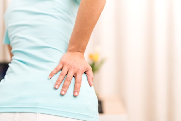 Back pain at home women suffer from backache healthcare and medical concept