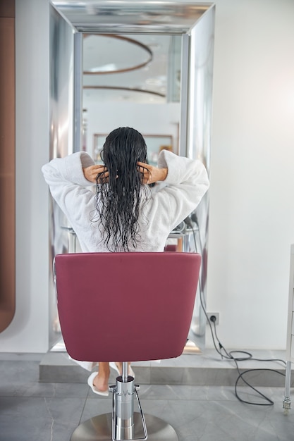 Back photo of a customer in a chair