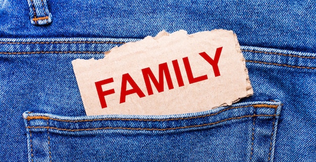 In the back pocket of the jeans there is a brown piece of paper with the text FAMILY