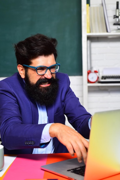 Back to school angry professor in classroom elearning online test teachers day bearded teacher in