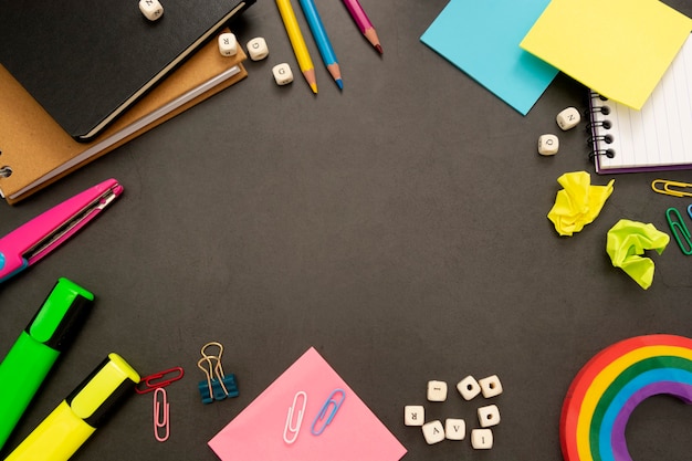 Back to school background with colourful pencils and office supplies