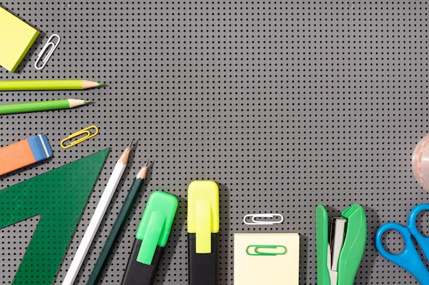 Back to school background with copy space Variety of Office and school supplies on gray background