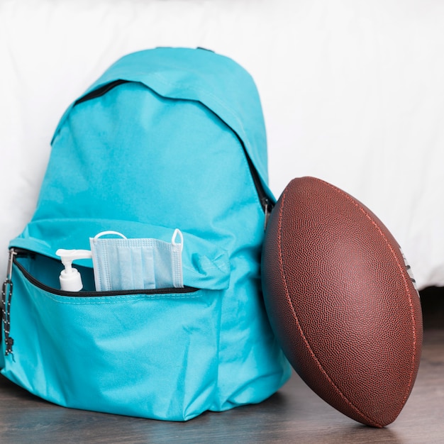 Back to school composition with blue backpack