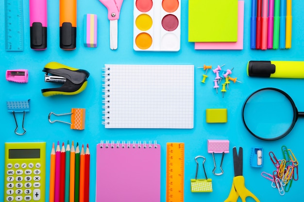 Back to school concept on blue background with copy space