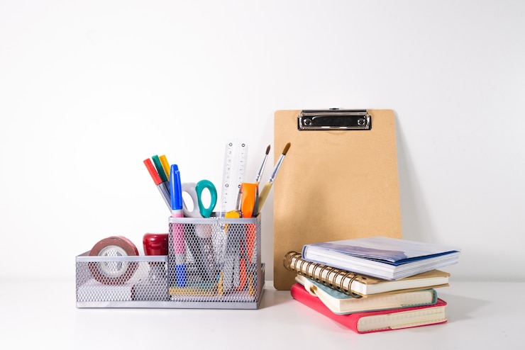 Photo back to school concept. pencil, pen and supplies in holder on white background