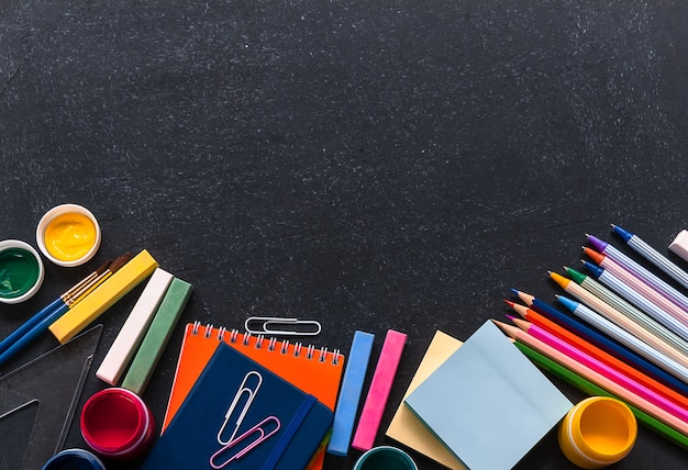 Photo back to school concept. stationery on the black background