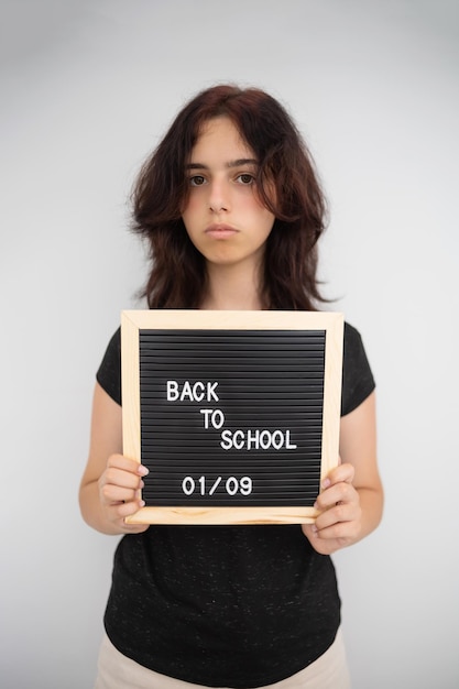 Photo back to school concept unhappy high school student