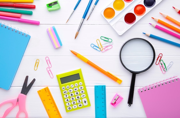 Back to school concept on white wooden background