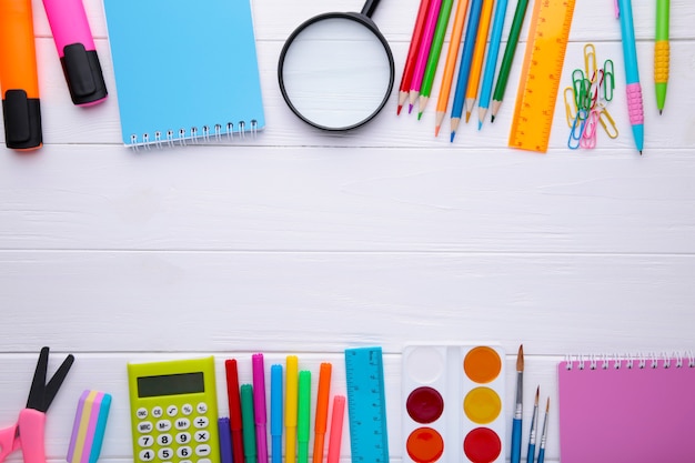 Back to school concept on white wooden background