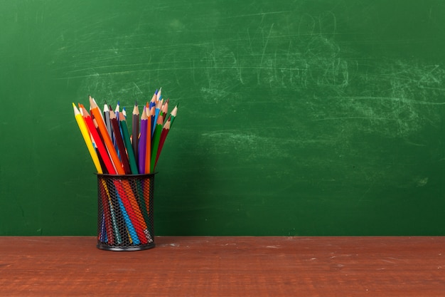 Photo back to school concept with stationery supplies and blackboard