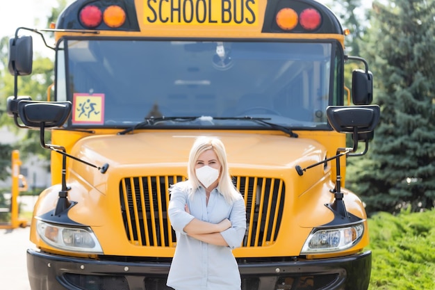 back to school during covid pandemics teacher with face mask