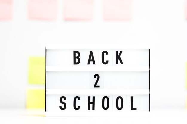 Back to school. Education concept. Lightbox on defocused sticker wall