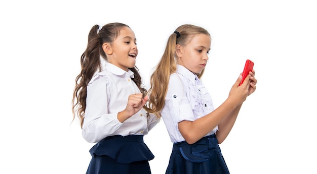 back to school girls children having selfie time school friends blogging and taking selfie with phone school children making selfie in classroom Friendship is a source of joy