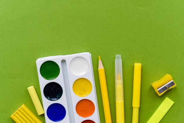 Back to school Items for the school on a green table