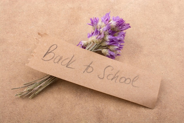 Back to school lettering with flower bouquet