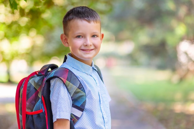 back to school a little boy goes to school beginning of lessons