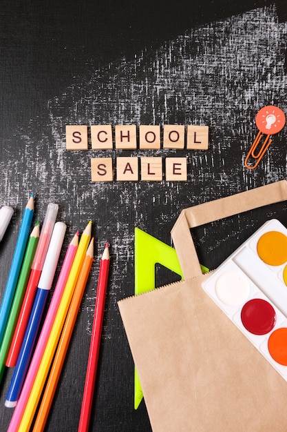 Back to School. School sale with trendy shadow on blackboard