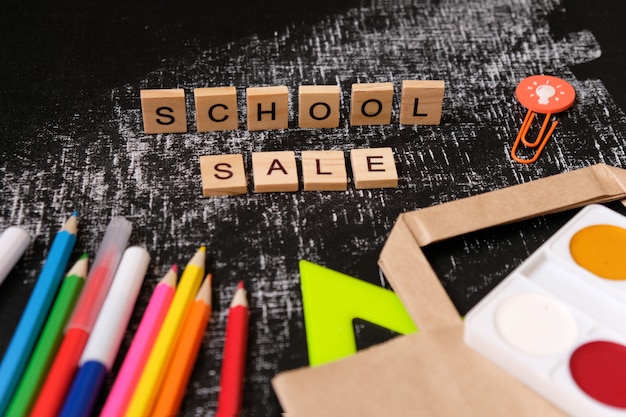 Back to School. School sale with trendy shadow on blackboard