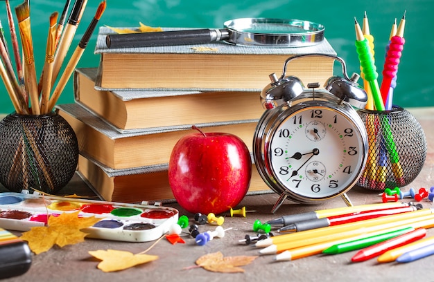 Back to school. School supplies in composition on the table.