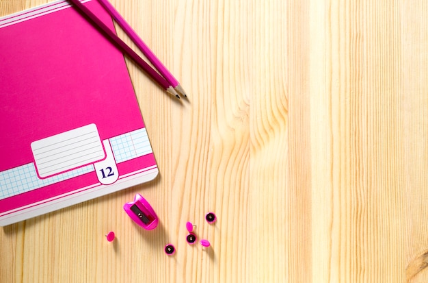 Back to school. school supplies on a wooden Board.