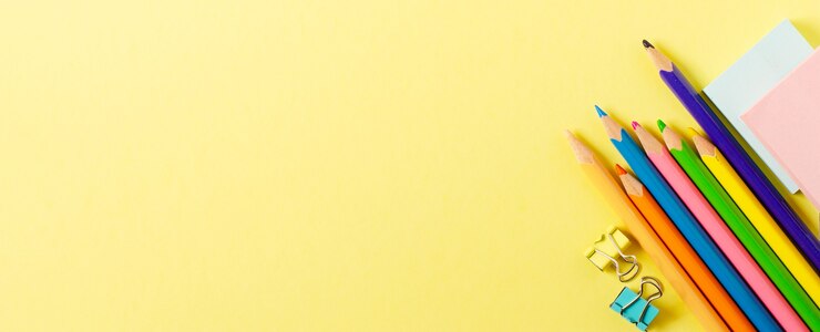 Back to school. School supplies on a yellow paper background. Copy space