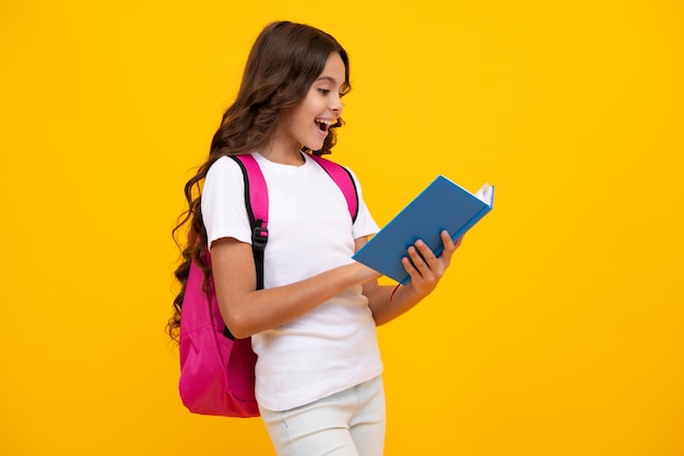 Back to school schoolgirl student with school bag backpack hold book on isolated studio background school and education concept teenager girl in school uniform