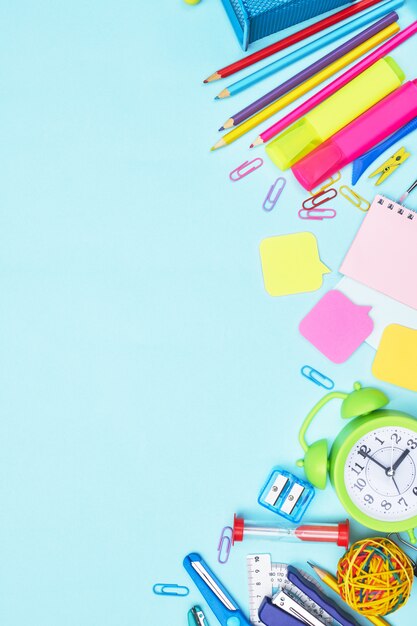 Back to school stationery on blue background, copy space one