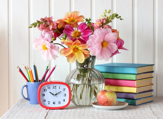 Photo back to school. still life with a bouquet of dahlias.