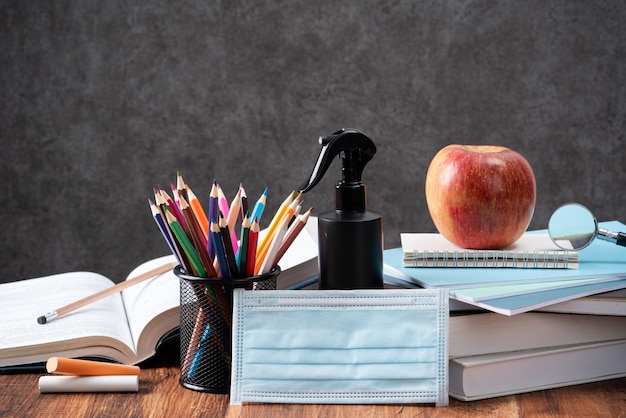 Back to school student design concept, close up of stationery over wooden table background with copy space.