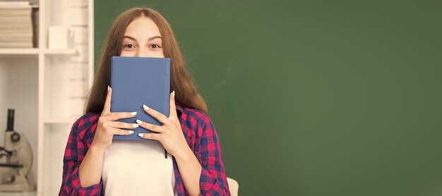 Back to school teen girl ready to study kid do homework with\
book teenager student banner of school girl student schoolgirl\
pupil portrait with copy space