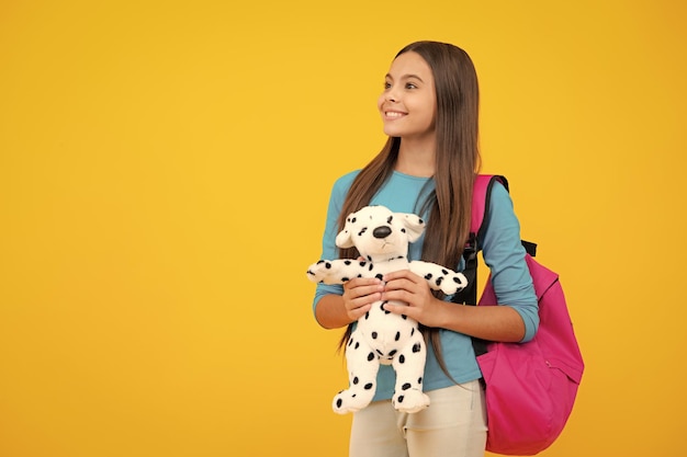 Back to school Teenager schoolgirl hold book with toy ready to learn School children on isolated