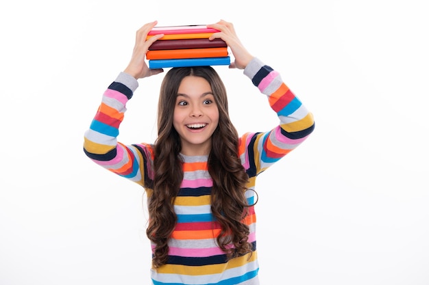 Back to school Teenager schoolgirl with book ready to learn School girl children on isolated white studio background Happy girl face positive and smiling emotions