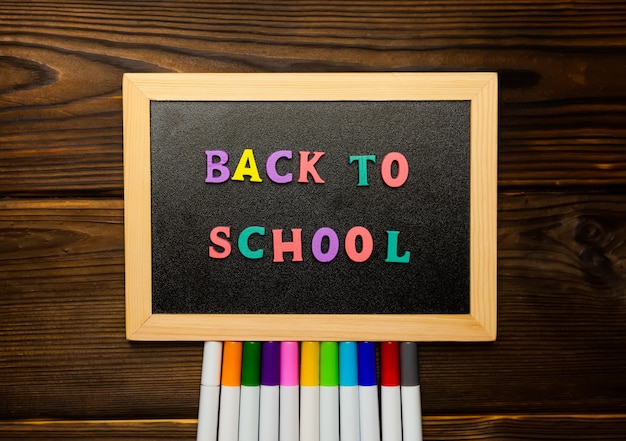 Back to school text colorful letters on blackboard