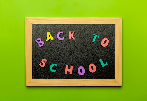 Back to school text colorful letters on blackboard