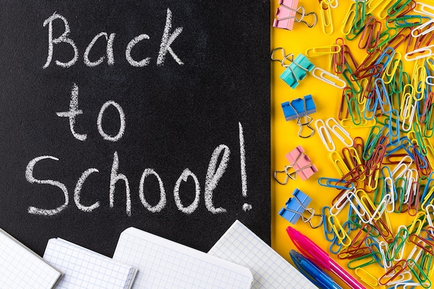 Back to School Text, School Stationary and Blackboard.