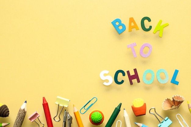 back to school wood text arrange on yellow background