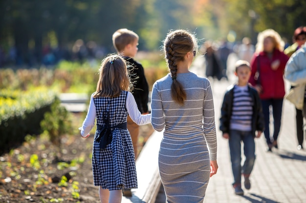 Back view of child girl and mother